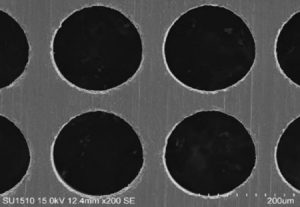 Laser drilling of taper free hole