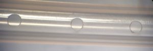 Laser hole drilling of catheter